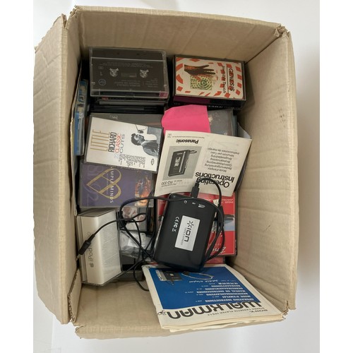 219 - A Sony Walkman cassette player, assorted cassettes and related items (box)