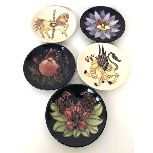 331 - A Moorcroft pin dish, decorated a flower, 12 cm wide, and four others, all boxed (5)