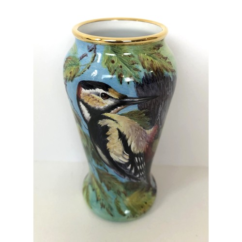 344 - A limited edition Moorcroft miniature enamel vase, Woodpeckers 8/75, 10 cm high, boxed with a certif... 