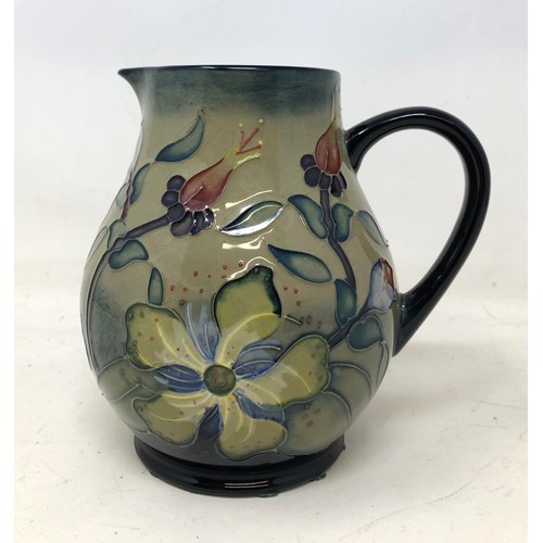 362 - A Moorcroft jug, decorated flowers, 15 cm high, boxed