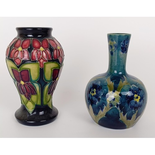 350 - A Moorcroft ginger jar and cover, decorated flowers, 10 cm high, and two other Moorcroft vases (3)