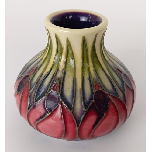 352 - A miniature Moorcroft vase, decorated flowers, 5 cm high, and two others (3)