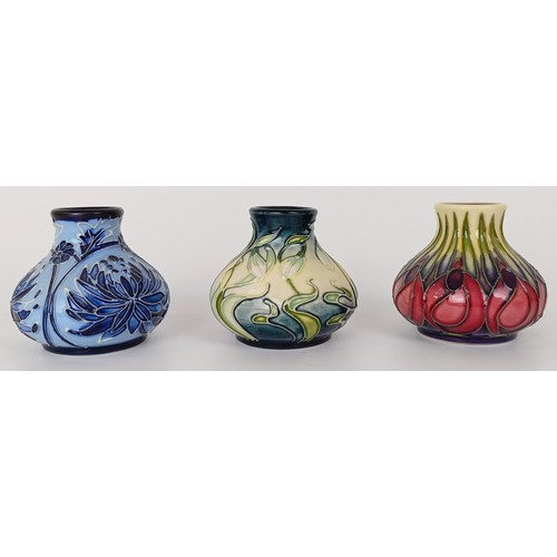 352 - A miniature Moorcroft vase, decorated flowers, 5 cm high, and two others (3)