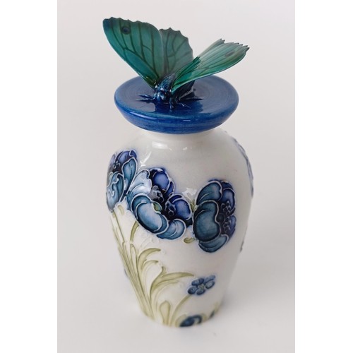 353 - A miniature Moorcroft vase, decorated flowers, 8 cm high, two others, and a novelty bottle stop, wit... 