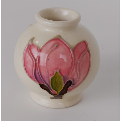 353 - A miniature Moorcroft vase, decorated flowers, 8 cm high, two others, and a novelty bottle stop, wit... 