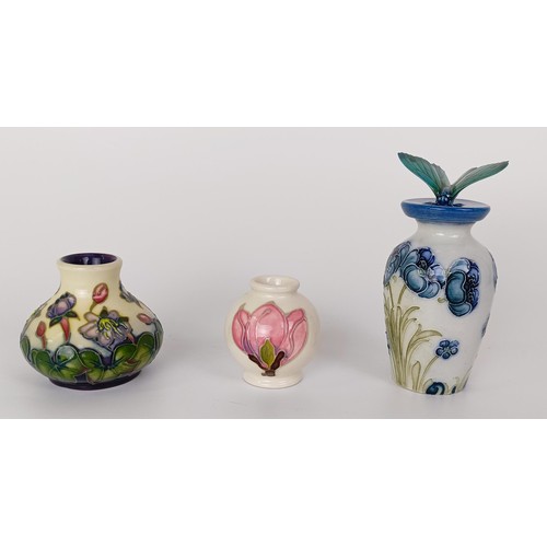 353 - A miniature Moorcroft vase, decorated flowers, 8 cm high, two others, and a novelty bottle stop, wit... 