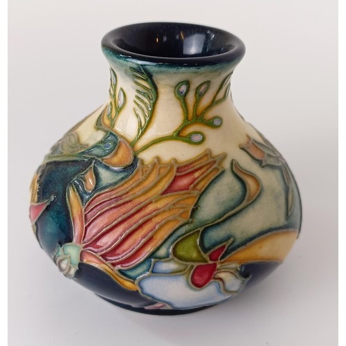 355 - A miniature Moorcroft vase, decorated flowers, 5 cm high, and three others (4)