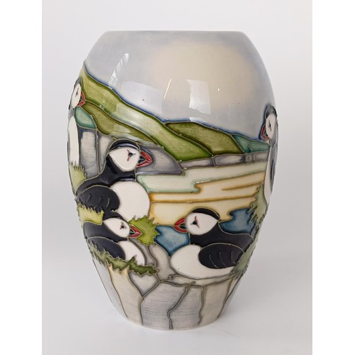 357 - A Moorcroft vase, decorated puffins, 23 cm high, a Moorcroft vase, decorated polar bears, 10 cm high... 