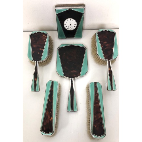 393 - An Art Deco silver, green enamel and tortoiseshell dressing table set, comprising a hand mirror, fou... 