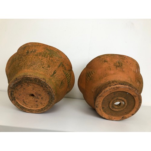 405 - A pair of French terracotta strawberry planters, impressed marks, 34 cm diameter (2) Provenance: Sol... 