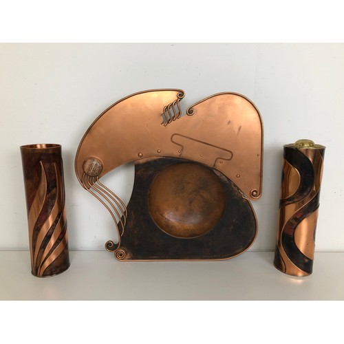 409 - An unusual copper tray, inset with a hardstone, 43 cm wide, and two vases, 28 cm high, initialled SF... 