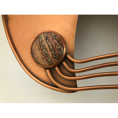 409 - An unusual copper tray, inset with a hardstone, 43 cm wide, and two vases, 28 cm high, initialled SF... 