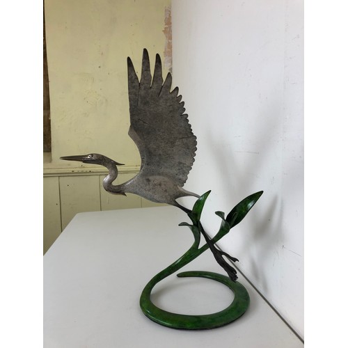 412 - ***Withdrawn*** A bronze figure of a crane, with outstretched wings, 40 cm wide