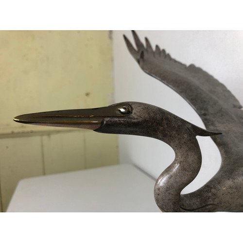 412 - ***Withdrawn*** A bronze figure of a crane, with outstretched wings, 40 cm wide