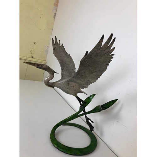 412 - ***Withdrawn*** A bronze figure of a crane, with outstretched wings, 40 cm wide