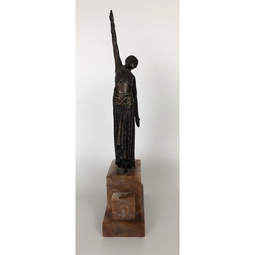 416 - An Art Deco style bronze figure, of a woman, on a marble base, 40 cm high