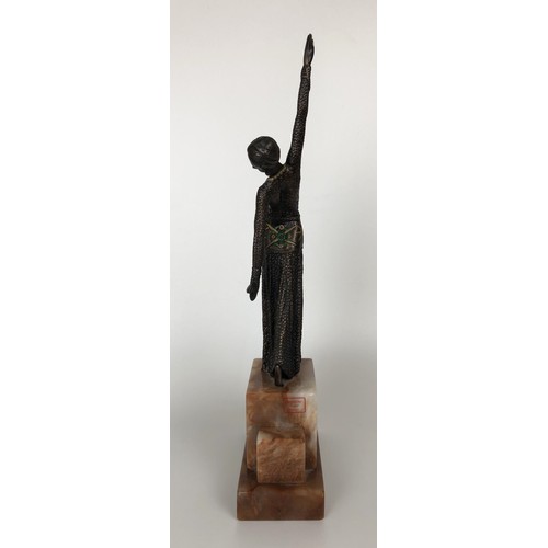 416 - An Art Deco style bronze figure, of a woman, on a marble base, 40 cm high