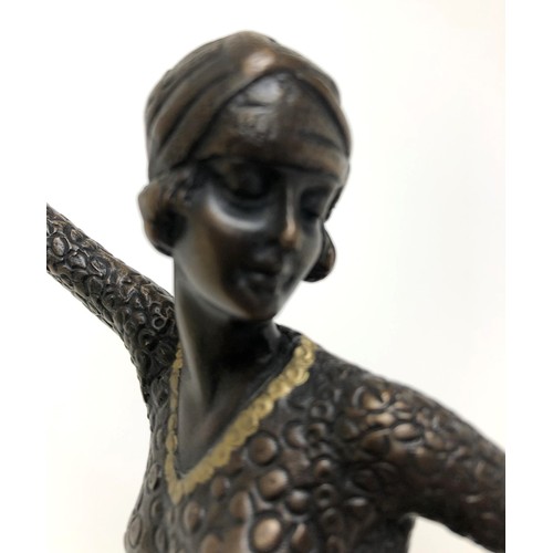 416 - An Art Deco style bronze figure, of a woman, on a marble base, 40 cm high