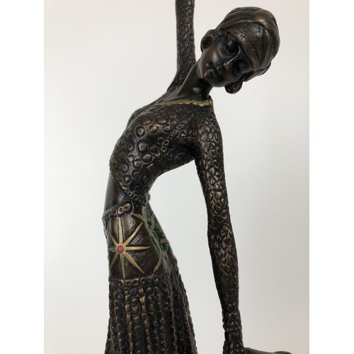 416 - An Art Deco style bronze figure, of a woman, on a marble base, 40 cm high