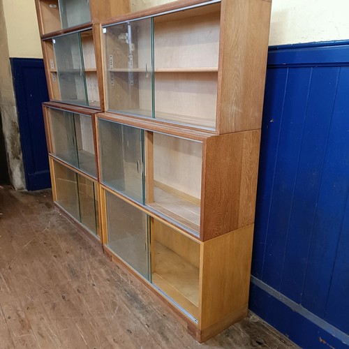 491 - A Minty sectional bookcase, another, and a teak chest of six drawers (3)