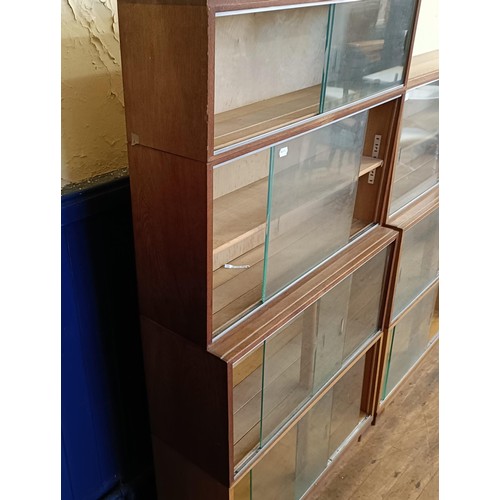 491 - A Minty sectional bookcase, another, and a teak chest of six drawers (3)