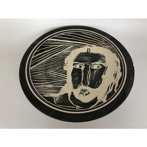 432 - An Art Pottery plate, decorated a portrait, 35 cm diameter