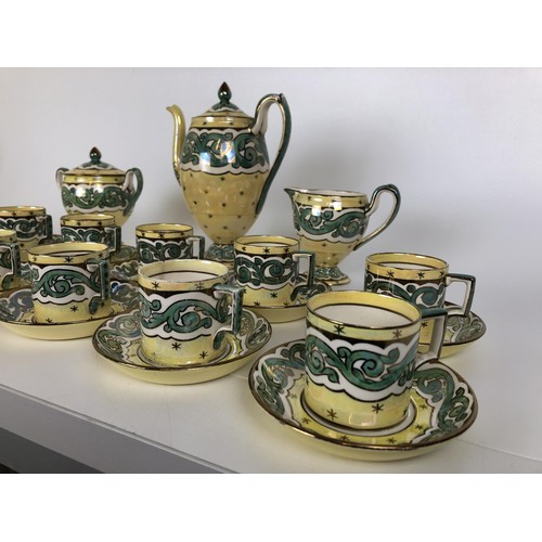 431 - A Wedgwood coffee set, decorated by Stella Lustre, comprising twelve cups and saucers, milk jug, sug... 