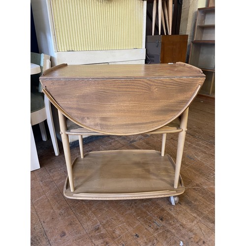 488 - An Ercol light elm three tier trolley, 70 cm wide