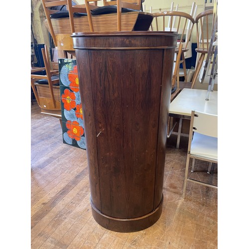 480 - A 20th century rosewood oval cabinet, with a single door, 128 cm high x 62 cm wide