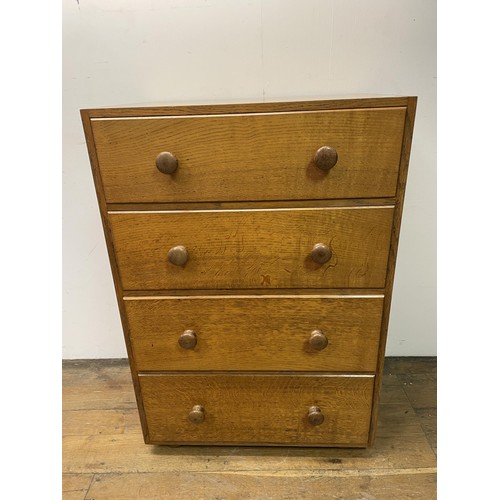 472 - A Cotswold school oak chest, having four drawers, 76  cm wide