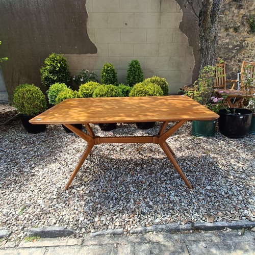 501 - A 1970s teak dining table, the top 138 x 176 cm