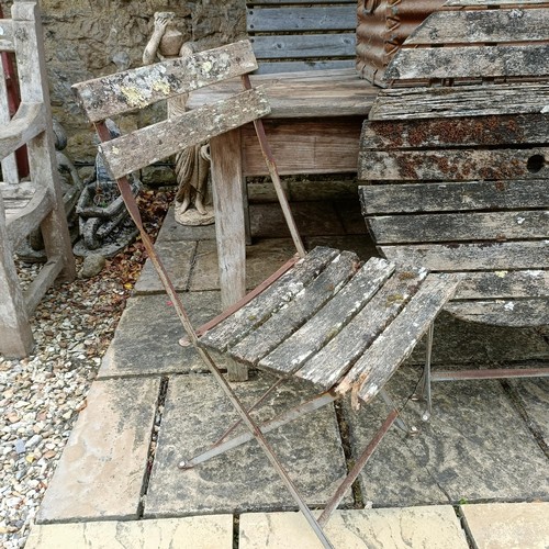 1141 - A weathered pine table, 153 cm wide, a pair of folding chairs, a folding table and a metal trunk (4)... 