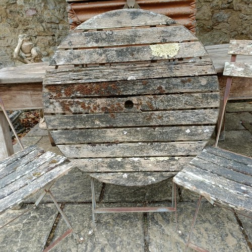 1141 - A weathered pine table, 153 cm wide, a pair of folding chairs, a folding table and a metal trunk (4)... 