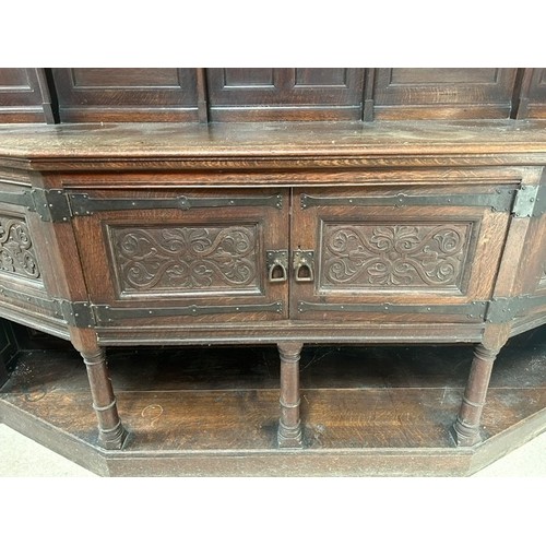 504 - A Liberty & Co large oak dresser, the superstructure with two leaded glazed doors, on a base wit... 