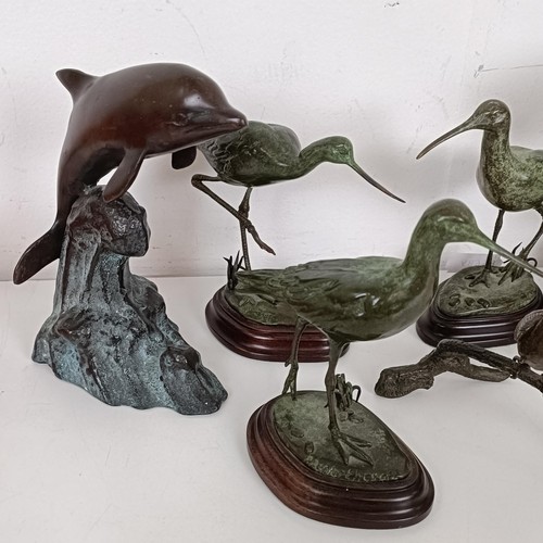 388 - A bronze figure of a water bird, 13 cm high, two others similar, and three other bronzes (6)