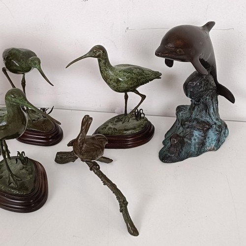 388 - A bronze figure of a water bird, 13 cm high, two others similar, and three other bronzes (6)