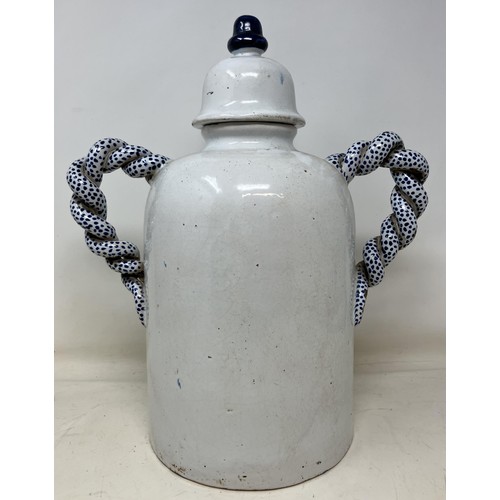 1200B - A Delft twin handled apothecary jar and cover, Diascordium, 36 cm high