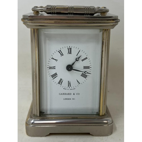 1210 - ***Withdrawn*** A pair of silver plated candelabra, a silver plated miniature carriage clock, assort... 