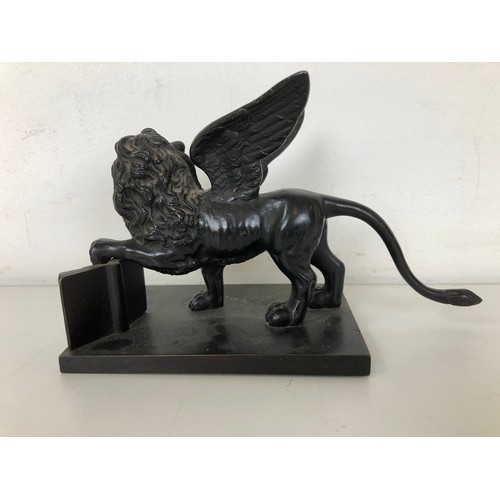 1261 - A bronze figure of the Lion of Venice, 9 cm high