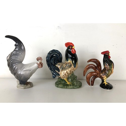 1270 - A Royal Copenhagen cockerel, 19 cm high, and two other chicken figures (3) Provenance: Sold on behal... 