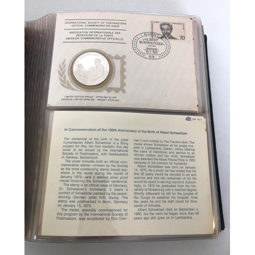 1282 - A set of International Society Of Postmasters (1975-1977) sterling silver medallion covers, bound (b... 