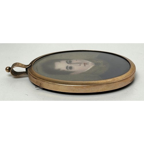 674A - English school, an oval portrait miniature of a young gentleman, in a yellow metal frame, 7 x 5 cmIv... 