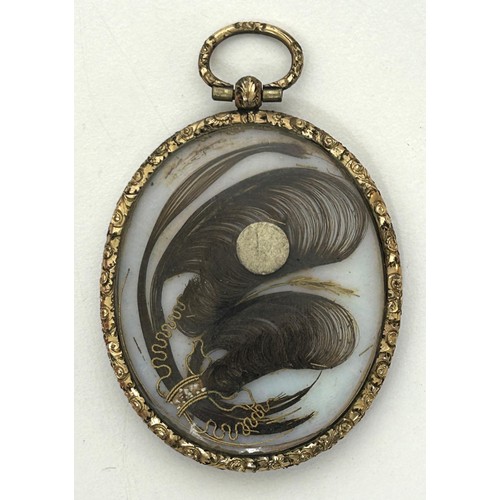 674D - English school, an oval portrait miniature of a gentleman, verso inset with a lock of hair, in a gil... 