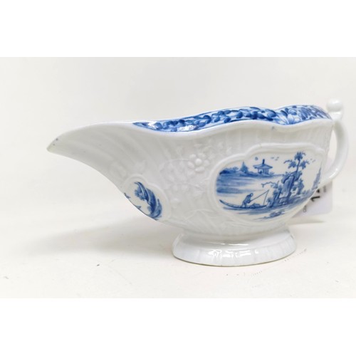 1294 - A blue and white porcelain sauce boat, decorated figures in a landscape, 18 cm