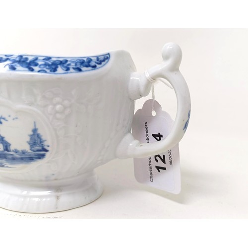 1294 - A blue and white porcelain sauce boat, decorated figures in a landscape, 18 cm