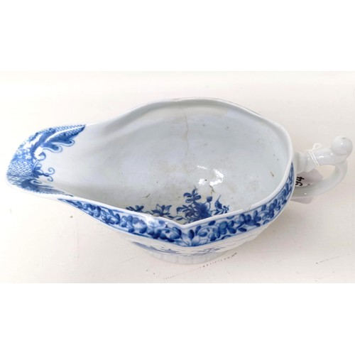 1294 - A blue and white porcelain sauce boat, decorated figures in a landscape, 18 cm