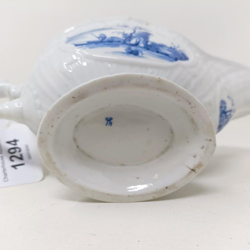 1294 - A blue and white porcelain sauce boat, decorated figures in a landscape, 18 cm