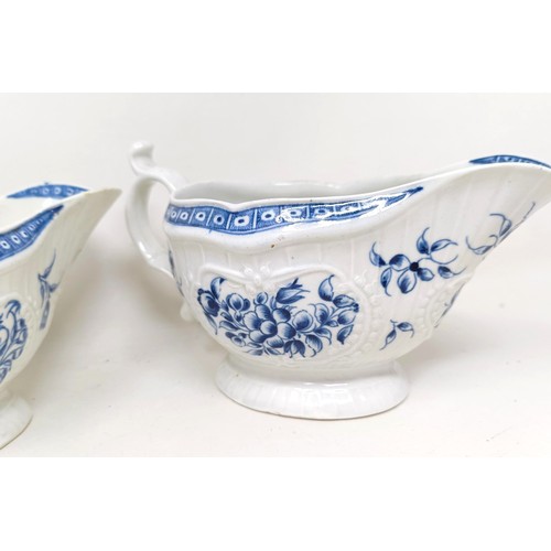 1273 - A pair of Worcester porcelain blue and white sauce boats, decorated flowers, open crescent mark to b... 