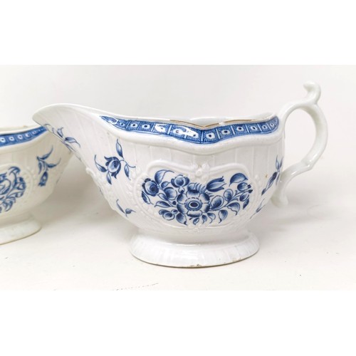 1273 - A pair of Worcester porcelain blue and white sauce boats, decorated flowers, open crescent mark to b... 