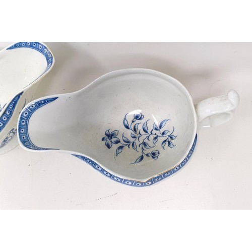 1273 - A pair of Worcester porcelain blue and white sauce boats, decorated flowers, open crescent mark to b... 